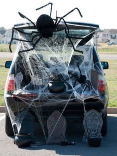 a car decorated for halloween with spider web