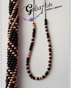 the beaded necklace is black and brown