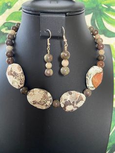 You will receive an unbelievably beautiful, genuine, ocean jasper beaded necklace with matching earrings. This necklace is strung entirely with ocean jasper focal beads. The faceted focal beads have wonderful grayish-brown, beige and peach markings and patterns.  They measure 1 1/2" x 1" at their longest and widest, and are two-sided.  I have shown both sides in the pics provided.  No joke! This very natural-looking necklace is gorgeous This stunning, eye-catcher makes quite a statement! It has Earthy Jasper Hand-strung Jewelry, Earthy Jasper Gemstone Beads Jewelry, Earthy Jasper Round Bead Jewelry, Nature-inspired Jasper Gemstone Beads Jewelry, Wooden Bead Jewelry, Handmade Ceramic Jewelry, Diy Necklaces, Jasper Jewelry, Bead Ideas