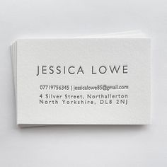 a business card that is on top of a table