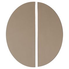 two circular mirrors are shown side by side, one is beige and the other is white