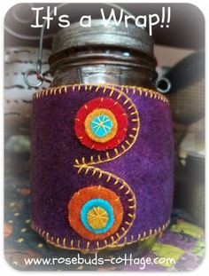 it's a wrap jar with buttons on the side and an embellishment in the middle