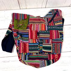 Elevate your bohemian style with our Handmade Gheri Cotton Patchwork Sling Bag, a unique and colorful accessory designed for those who appreciate artistry and functionality.Artisanal Craftsmanship: Handcrafted with care, each bag features a distinctive patchwork design using Gheri cotton, known for its durability and vibrant patterns. Multi-Pocket Design:Stay organized on the go with multiple pockets. This sling bag includes a spacious main compartment, two front pockets with Velcro closure, one Artisan Multicolor Rectangular Hobo Bag, Multicolor Handmade Hobo Bag, Handmade Multicolor Hobo Bag, Artisan Multicolor Bag With Adjustable Strap, Casual Green Patchwork Shoulder Bag, Multicolor Artisan Hobo Tote Bag, Artisan Multicolor Hobo Tote Bag, Artisan Multicolor Tote Shoulder Bag, Artisan Multicolor Shoulder Bag With Adjustable Strap