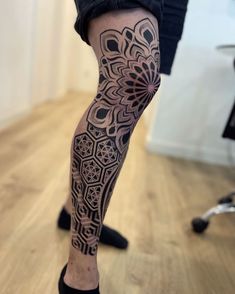 a person with a tattoo on their leg