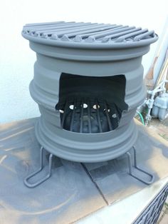 an outdoor stove sitting on top of a roof