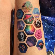 a person with a tattoo on their arm that has many different pictures and flowers in it