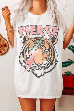 Fierce Vintage Tiger Oversized Graphic Tee is printed on the popular Comfort Colors 1717 Relaxed Oversized T Shirt. Lightweight and super soft, this shirt is a comfortable fit for effortless style. For a more oversized fit, Honey Tee suggests sizing up one size. For more accurate measurements, visit the Comfort Colors website. Women's Graphic T-shirts, Tiger Graphic Tee, Trending Graphic Tees 2024, Graphic Oversized Tshirt, Colors Website, Lsu Gameday, Pto Ideas, Fierce Animals, Vintage Tiger