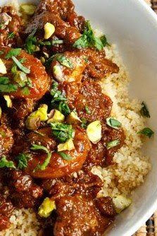 a white bowl filled with rice and meat