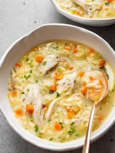 two bowls filled with chicken and vegetable soup