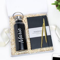 --------------------- What's Included: --------------------- • Personalized stainless steel water bottle 500ml• Classic ruled notebook black hardcover 5" × 8.25"• Two-set gold slim pen - black ink• Personalized cardAll contents are carefully packed with crinkle paper, wrapped with tissue paper and tied with a beautiful matching ribbon to complete an unforgettable unboxing experience. Personalized items are custom made with high-quality permanent vinyl. Hand washing is recommended. Please ensure Welcome Package For New Employees, Make Someone Smile Today, Personalized Gift Boxes, Welcome Package, Welcome To The Team, Make Someone Smile, Crinkle Paper, Ruled Notebook, Personalised Gift Boxes