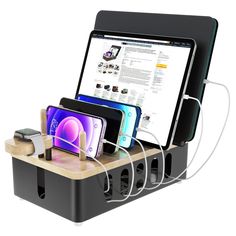 there is a cell phone charging station attached to the ipad and tablet with multiple devices in it