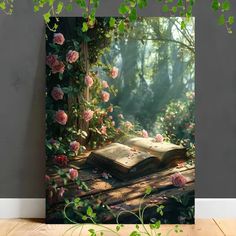 an open book sitting on top of a wooden table in front of a forest filled with roses