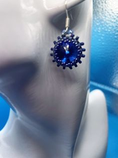 Sparkly sapphire blue rivoli bezeled in shades of blue, this gorgeous earring is a year-round look.  While it would look great with nice jeans and a white blouse, you can wear it for any dressy occasion.   Catches the light as you move your head.   Stunning in person. Blue Round Beaded Metal Earrings, Blue Crystal Earrings With Ear Wire For Formal Occasions, Blue Crystal Earrings For Gifts, Blue Round Crystal Earrings For Gifting, Blue Crystal Round Earrings For Gift, Blue Round Crystal Earrings In Metal, Blue Round Crystal Earrings For Gift, Gift Blue Round Crystal Earrings, Blue Metal Beaded Earrings For Party