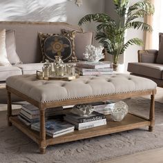 a living room with couches, chairs and a coffee table in front of a window