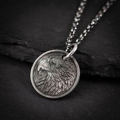 Unique Handmade Sterling Silver 925 American eagle coin necklace. Wearing an eagle necklace symbolizes a variety of powerful traits, including freedom, vision, strength, and courage. It can signify personal independence, clarity of thought, spiritual connection, and leadership. In some cultures, it also represents patriotism and national pride. Additionally, the eagle's association with protection, transformation, and a deep connection to nature enhances its significance, making the eagle neckla Etched Coin-shaped Jewelry Gift, Symbolic Silver Coin Necklace As Gift, Symbolic Silver Coin Necklace Gift, Symbolic Silver Coin Necklace For Gift, Sterling Silver Etched Coin Jewelry, Etched Sterling Silver Coin Jewelry, Etched Coin-shaped Sterling Silver Jewelry, Antique Silver Coin Pendant Jewelry As Gift, Silver Stamped Coin Necklace Gift