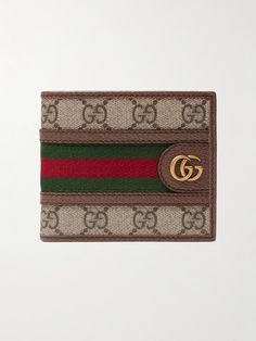 Gucci's 'Ophidia' wallet is inspired by accessories from the house's archive. It's made from coated-canvas printed with the iconic 'GG' monogram, which matches the burnished gold-tone hardware, and is centred by red and green webbing stripes. Gucci Collection, Leather Billfold, Gucci Ophidia, Gg Monogram, Wallet For Men, Billfold Wallet, Mr Porter, Wallet Men, Porter