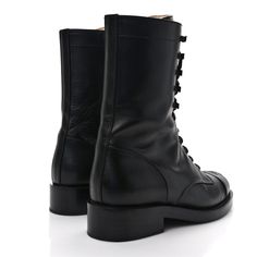 This is an authentic pair of CHANEL Crumpled Calfskin Lace Up Combat Boots size 37 in Black. These stunning boots are crafted of calfskin leather in black. The boots feature a 1.25-inch heel and a leather cap toe with a stitched Chanel CC logo. Lace Up Combat Boots, Leather Cap, Cc Logo, Combat Boots, Calf Skin, Chanel, Lace Up, Thing 1, Boots