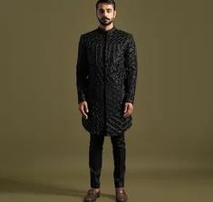 The Achkan is a marvel of tailoring, made from premium black suiting fabric. It features an intricate floral geometric pattern, brought to life with leather cord, thread, and Cutdana embroidery. This detailed workmanship creates a texture that is both visually striking and sophisticated.

Size Chart For Men





	
	
					Men's Size Chart
		

		
		
						
				Size Chart For Men
				Custom Size Measurement Guide
			
			
				
				
				Custom Size Measurement Guide
1. Take your measurements at ease… Designer Kurta With Geometric Embroidery For Festive Occasions, Designer Embroidered Traditional Wear For Semi-formal Occasion, Designer Embroidered Black Kurta, Designer Black Embroidered Kurta, Traditional Bandhgala With Geometric Embroidery For Eid, Tailored Elegant Bandhgala For Designer Wear, Black Long Sleeve Designer Bandhgala, Designer Embroidered Semi-formal Kurta, Designer Tailored Kurta For Semi-formal Occasions