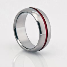 a wedding ring with red and white stripes on the inside, in silver plated stainless steel