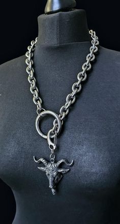 Punk rock/ goth style heavy duty stainless steel necklace with a huge 60mm bhapomet skull toggle . Total chain length 22.5 inches.  Total weight: 269 grams This is a made to order item return not accepted for any made to order items. Cancellation not accept after 12hrs of placing order SHIPPING BY INTERNATIONAL AIRMAIL - DOES NOT PROVIDE TRACKING  I ship orders in the order they are received and according to requests (processing time may vary depending on work volume)  shipping times (times vary Heavy Chain Necklace, Goat Skull, Edgy Jewelry, Stainless Steel Chain Necklace, Heavy Chain, Toggle Necklace, Skull Necklace, Style Punk, Steel Necklace