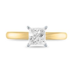 a yellow gold ring with a princess cut diamond