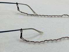 Easily keep your glasses around your neck with these dainty and fashionable beaded crochet glasses chains! They're comfortable enough for everyday use and for longtime wear. Take this chain to the beach to use for sunglasses too!  Available in multiple bead colors and finishes. The length of the chain is 26in. Beaded Metal Glasses Chains For Party, Metal Beaded Glasses Chains For Party, Adjustable Silver Glasses Chains, Adjustable Silver Glasses Chains For Beach, Silver Glasses Chains For Fashion Accessory, Adjustable Silver Glasses Chains For Parties, Crochet Glasses, Glasses Chains, Beaded Crochet