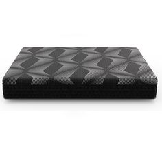 a black and white photo of a mattress with an intricate pattern on the bottom half