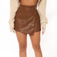 Brown Faux Leather Zipper Accented Skorts Category: Skirts/Shorts/Skorts True To Size S(4-6) M(8-10) L(12-14) Content: 60%Polyurethane 40%Spandex Measurements S W: 27” L: 13” I.S. 2 1/2” M W: 30” L: 13 1/2” I.S. 2 1/2” L W: 34” L: 14” I.S. 2 1/2” Pre Packed Casual Brown Mini Skirt, Skirt Shorts Leather, Cheap Brown Party Bottoms, Brown Bottoms With Zipper Closure For Spring, Trendy Short Mini Skirt For Fall, Faux Leather Mini Skirt With Zipper Closure, Mini Skirt With Zipper Closure For Night Out, Fall Faux Leather Mini Skort, Faux Leather Mini Skirt With Zipper For Fall