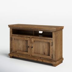 an old wooden entertainment center with two doors and one shelf on the bottom, against a white background