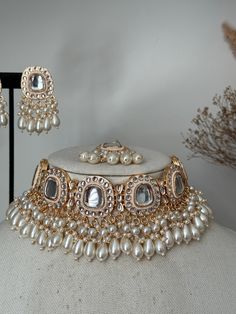 This stunning  uncut kundan necklace set comes with earrings tikkq . It's sleek and Lightweight . Great for modern and traditional look. Goes with traditional Indian dress , saree or western dress.    Choker width- 1.5 inches  Earrings- 2 inches  Style tip- ----------- Pair it with any beautiful traditional outfits  and flaunt with Unique style of collection from us. Perfect match for Festival and Traditional wear.  Take Care Tips-  ---------------- Kee away from perfume, Hair spray and. Moistur Luxury Silver Kundan Wedding And Engagement Jewelry, Costume Jewellery Indian, Cheap Kundan Necklaces For Festive Season, Luxury Kundan Necklace With Stone Work For Reception, Luxury Kundan Temple Jewelry Necklace With Matching Earrings, Luxury Heavy Kundan Necklace For Eid, Luxury Kundan Necklace For Eid Reception, Bridal Kundan Jewellery Set Kameswari Jewellers, Bridal Kundan Jewellery Set Glimour Jewellery