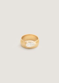 a gold ring with a diamond in the middle