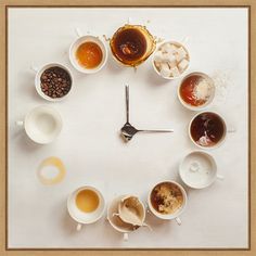 a clock made out of coffee cups and saucers