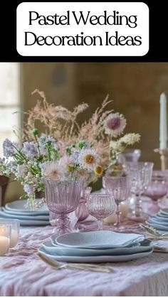 A pastel wedding decoration featuring a romantic table setting with soft pink linens, lavender glassware, stacked blue plates, and delicate floral centerpieces with pastel blooms, including blush and cream flowers, creating elegant pastel wedding decoration ideas for receptions or intimate dinners.