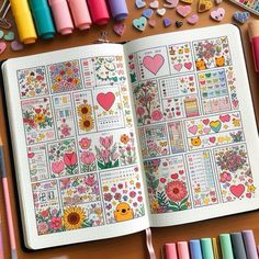 an open notebook with flowers and hearts on the pages, surrounded by crayons