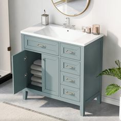 a bathroom with a sink, mirror and rug on the floor in front of it