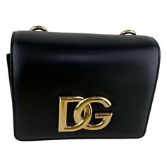 Brand Dolce&Gabbana Style Shoulder Bag Color Black Closure Buckle Features Dolce & Gabbana's Bag Is Part Of The '3.5' Collection - Each Style Is Embellished With A Gold-Tone 'Dg' Logo. Defined By A Small But Structured Shape, It's Been Made In Italy From Smooth Leather And Has An Adjustable Strap, So You Can Wear It Cross-Body. Inside, You'll Find An Organized Interior With Slots For Your Cards And Enough Space For Your Phone, Lipstick And Mints. Black Leather (Calf). Adjustable Shoulder Strap. Dg Logo, Card Sleeves, Shoulder Bag Black, Smooth Leather, Cross Body, Slots, Black Color, Dolce And Gabbana, Adjustable Straps