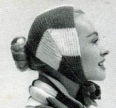 an old photo of a woman wearing a knitted hat and scarf, looking to the side