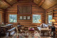 a living room with wooden walls and ceilings