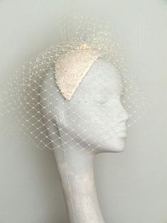 Vintage White Headpieces For Wedding, Vintage White Wedding Headpiece, Elegant Bead Cap Headband, Vintage Wedding Headpiece With Structured Crown, Wedding Headband With Bead Caps, Elegant Silver Wedding Fascinator, Elegant Silver Fascinator For Wedding, Elegant Cream Party Veil, Elegant Wedding Headband Veil