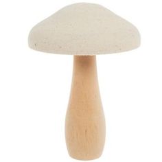 a small wooden mushroom sitting on top of a table