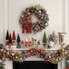 a fireplace decorated with christmas decorations and ornaments