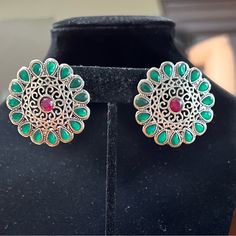 German Silver Stud Earrings With Ruby And Emerald Diamonds Surrounding Her Like A Flower. Versatile, Will Match So Many Outfits! Silver Round Flower Earrings For Party, Silver Flower Earrings For Party, Green Metal Earrings For Festive Occasions, Festive Green Metal Earrings, Silver Round Clip-on Earrings For Festive Occasions, Ethnic Indian Wear, Green Statement Earrings, Blue Statement Earrings, Hot Pink Earrings