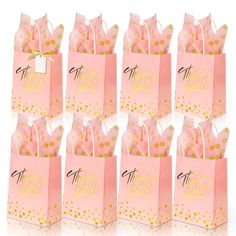 pink paper bags with gold polka dots and the words happy birthday written on each bag