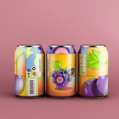 three cans of soda on a pink background, one has grapes and the other has green leaves