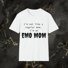 "The \"I'm an Emo Mom\" T-shirt is a charming and endearing piece of clothing that effortlessly combines humor and style. This cute and quirky T-shirt is perfect for moms who want to showcase their unique sense of humor while embracing their individuality. The shirt features a bold and playful design, with the phrase \"I'm an Emo Mom\" prominently displayed on the front. The lettering is typically in a bold, eye-catching font, and it's often complemented by graphics or illustrations that add to Quirky T Shirts, Emo Fashion, Cute Tshirts, Casual Everyday, Playful Design, Music Notes, Piece Of Clothing, Running Errands, Adult Outfits