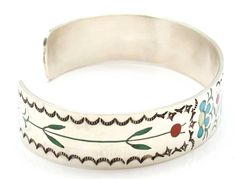 "Zuni bracelet by Sammy & Esther Gaurdian which reflect their high degree of skill in both lapidary and silversmithing. The bracelet features a turquoise oriole along with flowers and leaves all inlaid in exquisite fashion. Bracelet is 5.25"" from tip to tip, 1/2"" wide and will fit a wrist circumference of up to 6.5"". Variations occur from one bracelet to another. " Traditional Stamped Turquoise Jewelry, Traditional Engraved Turquoise Bracelets, Traditional Turquoise Engraved Bracelet, Artisan Inlay Bracelets As A Gift, Artisan Bangle Bracelets With Inlay, Artisan Sterling Silver Bracelet With Inlay, Traditional Adjustable Cuff Bracelet With Inlay, Traditional Turquoise Bracelet With Inlay, Traditional Inlay Cuff Bangle Bracelet