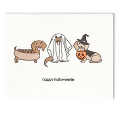 a card with three dogs dressed up in halloween costumes and one dog wearing a ghost costume