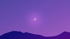 the moon is setting in the purple sky above some mountain tops, with mountains behind it