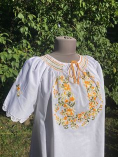 Traditional Hungarian Matyó floral handembroidered blouse . This blouse is new. Peasant blouse, colorful peasant blouse, embroidered blouse, embroidered peasant blouse, floral blouse, ethnic embroidered blouse Beautiful wide shape boho, hippie, folk blouse with floral embroidered pattern.  Handmade blouse M size Length:  27" Bust : 46-47" Hand wash only. If you are buying several pieces I can combine postage at the time of mailing. If you have any question please don't hesitate to contact me, Traditional Spring Blouse With Machine Embroidery, Peasant Top With Multicolor Embroidery And Embroidered Hem, Multicolor Embroidered Peasant Top, Folk Peasant Top With Multicolor Embroidered Neckline, Spring Peasant Top With Multicolor Intricate Embroidery, Traditional Spring Peasant Top With Embroidered Neckline, Spring Folk Style Tops With Machine Embroidery, Folk Style Spring Tops With Machine Embroidery, Folk Style Peasant Top With Floral Embroidery For Spring