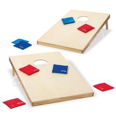 two cornhole game boards with red and blue pieces on them